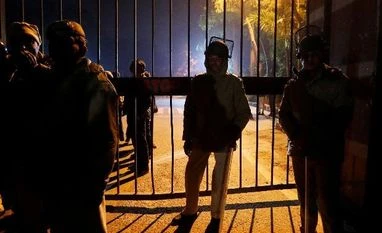 Delhi Police files two FIRs for switching off, vandalising JNU server room Police in riot gear stand guard inside the Jawaharlal Nehru University (JNU) after clashes between students in New Delhi, India, January 5, 2020.