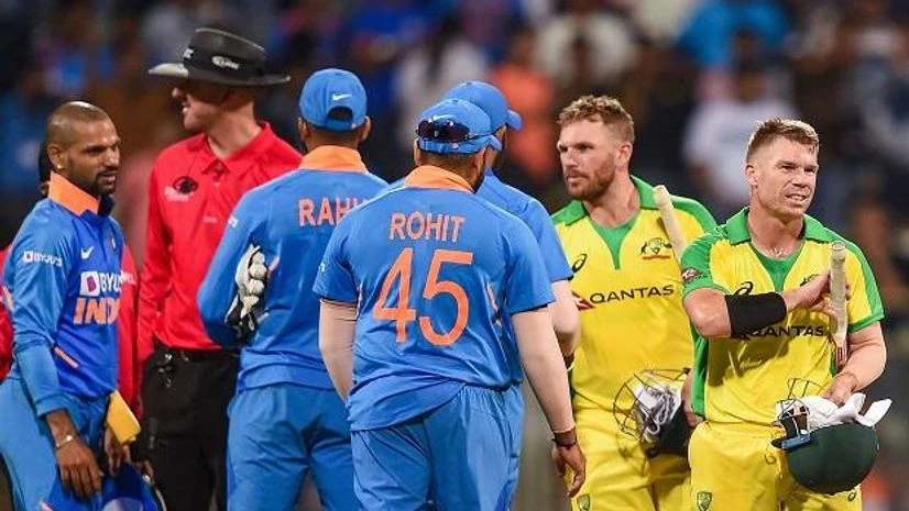 Australian batsman David Warner and Aaron Finch being congratulated by Indian players after they chased down the target to win the first one day international (ODI) cricket match at the Wankhede Stadium in Mumbai. Photo: PTI Australian batsman David Warner and Aaron Finch being congratulated by Indian players after they chased down the target to win the first one day international (ODI) cricket match at the Wankhede Stadium in Mumbai. Photo: PTI
