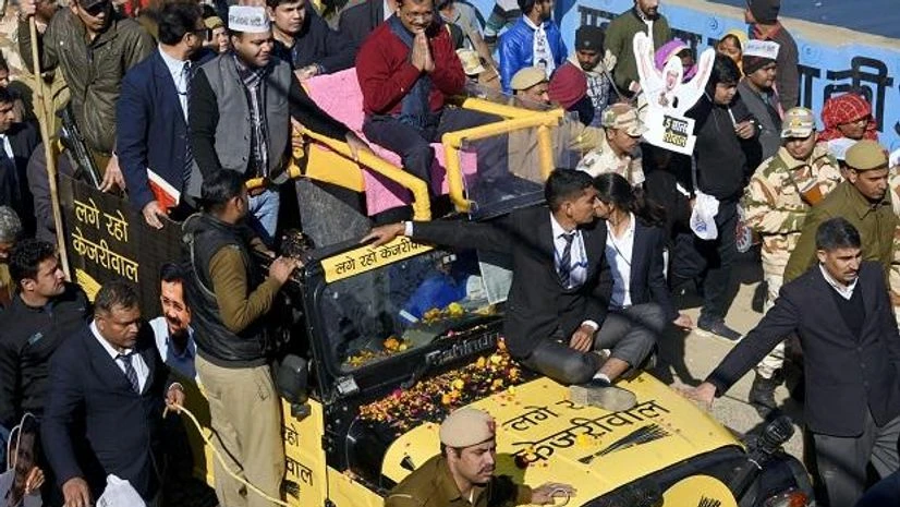 Arvind Kejriwal, Gulab Singh Yadav Delhi Chief Minister Arvind Kejriwal along with AAP MLA and candidate Gulab Singh Yadav, during a roadshow, in New Delhi. Photo: ANI
