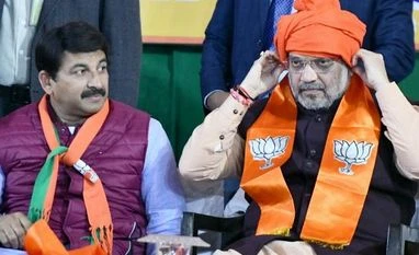 Delhi elections: Amit Shah's poll rhetoric sets Delhi campaign on fire Amit Shah, Manoj Tiwari