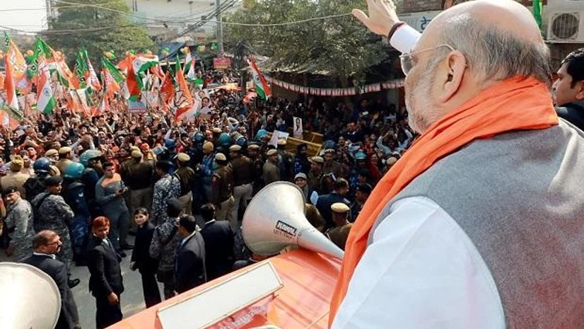 Amit Shah Union Home Minister Amit Shah during a roadshow ahead of Delhi assembly polls in New Delhi. Photo: ANI