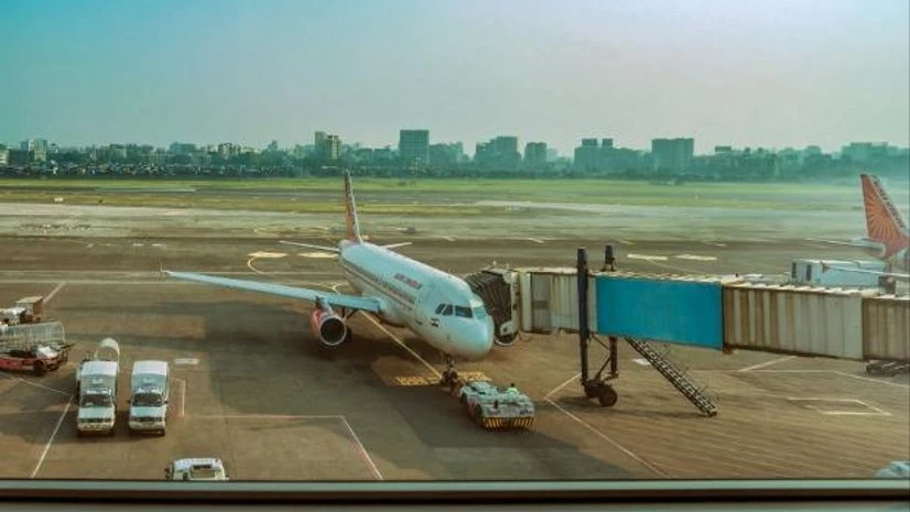 aviation, flight, plane Air India Passanger Aircraft parked connected to aero bridge for passangers boarding at New Delhi