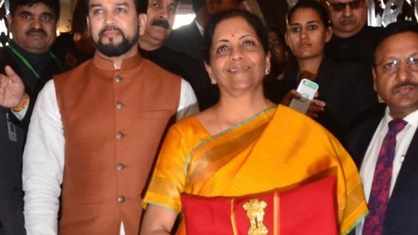 Nirmala Sitharaman, Budget 2020 Finance Minister Nirmala Sitharaman, flanked by her deputy Anurag Thakur (L) shows a folder containing the Union Budget documents, at Parliament house in New Delhi (Photo-Sanjay.K.Sharma)