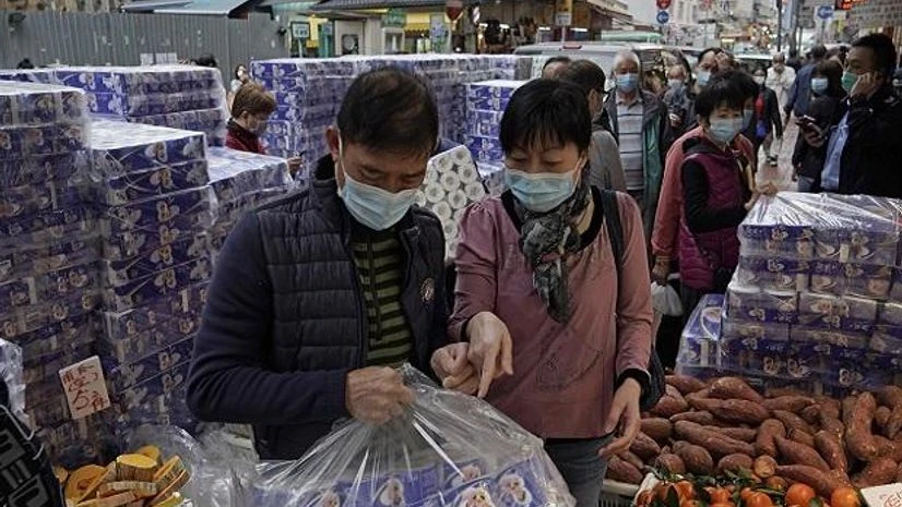 Hong Kong: Customers wearing masks buy bath tissue papers at a store Hong Kong: Customers wearing masks buy bath tissue papers at a store