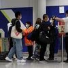 Passengers arriving at the Hong Kong International Airport get checked for coronavirus flu. The virus outbreak is fanning fears of global isolation	Photo: Reuters