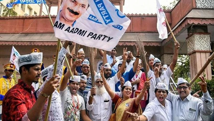 Delhi Assembly election, election results Aam Aadmi Party workers celebrate the party's success in Delhi Assembly polls at Shivaji Chowk, Vashi in Navi Mumbai. Photo: PTI