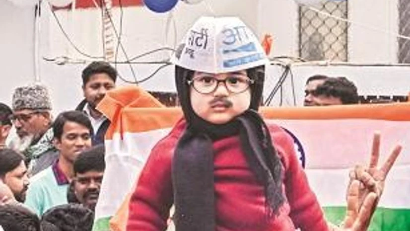 Delhi elections, A boy dressed as Arvind Kejriwal, amid celebrations by party workers at AAP’s headquarters in New Delhi | Photo: PTI