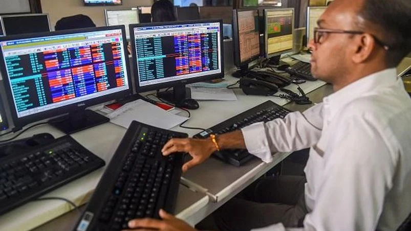 Markets Traders monitor BSE index at a brokerage firm, as the Sensex goes down, in Mumbai | PTI