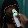A medic conducts screening of a patient as part of a precautionary measure for novel coronavirus (COVID-19) outbreak, at a government run hospital in New Delhi | PTI photo