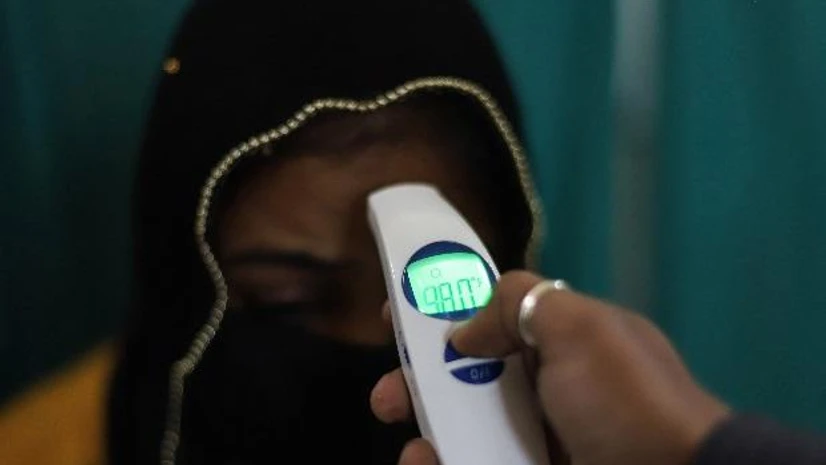 coronavirus New Delhi: A medic conducts screening of a patient as part of a precautionary measure for novel coronavirus (COVID-19) outbreak, at a government run hospital in New Delhi | PTI photo