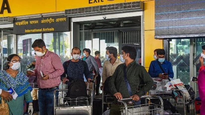 Coronavirus outbreak: 60 students stranded in Singapore arrive in Mumbai Dubai flight passengers wearing masks leave from NSCBI Airport for quarantine location, as a measure to prevent the spread of novel Coronavirus, Kolkata