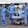 Houston: A woman is taken on a stretcher by healthcare professionals into the United Memorial Medical Center after going through testing for COVID-19 Thursday, March 19, 2020, in Houston