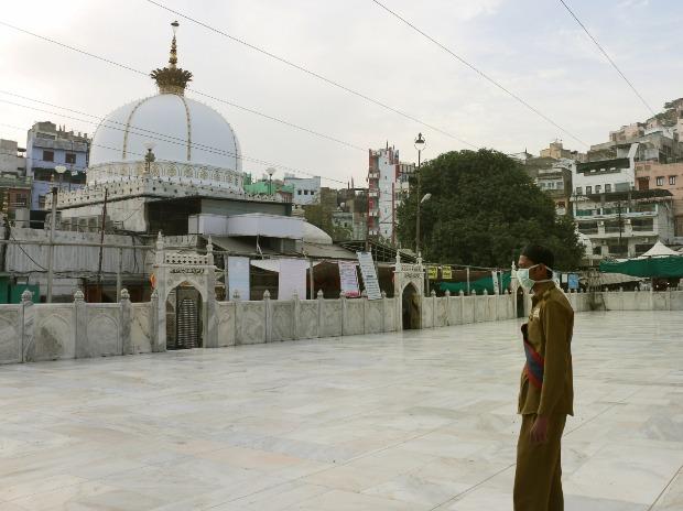 A man wearing a protective mask stands near the deserted Khwaja Moinuddin Chishti Dargah in the wake of coronavirus pandemic, in Ajmer A man wearing a protective mask stands near the deserted Khwaja Moinuddin Chishti Dargah in the wake of coronavirus pandemic, in Ajmer