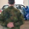 A doctor takes a smear test at the drive-in test station organized by the German Armed Forces in a hall of the former SaarbrÃ¼cken Trade Fair Centre, Germany. Photo: PTI
