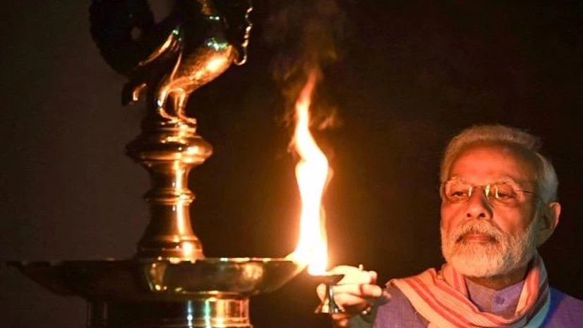 Prime Minister Narendra Modi lights a lamp to express the country's unity in fight against COVID19 during a nationwide lockdown in the wake of coronavirus pandemic, in New Delhi. Photo: PTI Prime Minister Narendra Modi lights a lamp to express the country's unity in fight against COVID19 during a nationwide lockdown in the wake of coronavirus pandemic, in New Delhi. Photo: PTI