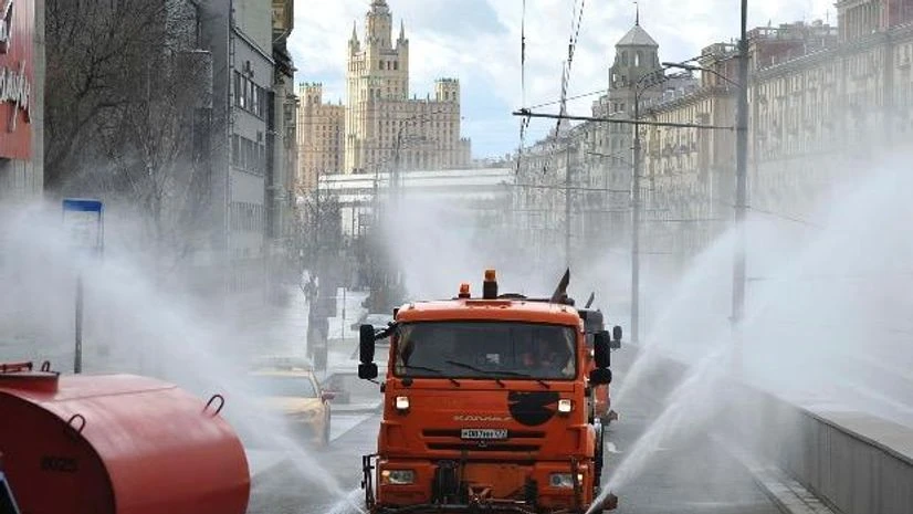Municipal tankers spray disinfectant as a precaution against the coronavirus, on a street in Moscow, Russia. Photo: PTI Municipal tankers spray disinfectant as a precaution against the coronavirus, on a street in Moscow, Russia. Photo: PTI