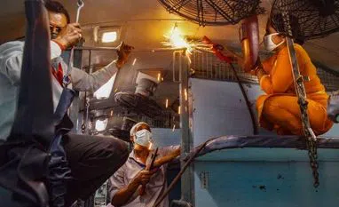 lockdown, coronavirus Railway technicians modify a train coach into an isolation ward for the treatment of Covid-19 affected patients, in Prayagraj