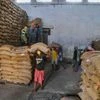 Labourers carry sacks of rice at a government godown during the nationwide lockdown imposed in the wake of coronavirus pandemic, in Dharmanagar, Tripura