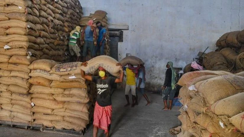Labourers carry sacks of rice at a government godown during the nationwide lockdown imposed in the wake of coronavirus pandemic Labourers carry sacks of rice at a government godown during the nationwide lockdown imposed in the wake of coronavirus pandemic, in Dharmanagar, Tripura