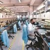 A lone employee works at the Sahasra Electronics main production facility, inside Noida SEZ.	Photo: Dalip Kumar