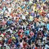 Migrant workers gather outside Bandra West Railway Station as they defy lockdown norms and request to leave for their native places after Prime Minister Narendra Modi had announced the extension of nationwide lockdown till May 3. Photo: PTI