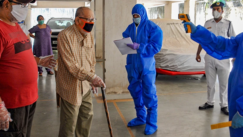 coronavirus, Covid-19, lockdown Thermal screening of residents of Mudiali area being conducted after it was sealed following the detection of Covid-19 positive case. Photo: PTI
