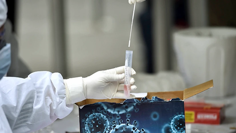 coronavirus testing, Covid-19 testing Health workers collect swab samples from people for COVID -19 tests, in New Delhi. Photo: PTI