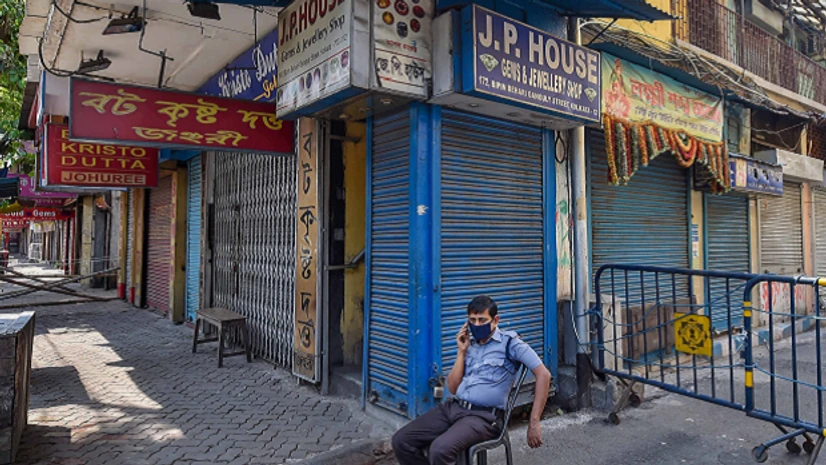 Kolkata Kolkata: A security person guards outside jewellery shops which remain shut despite auspicious festival of Akshaya Tritiya owing to COVID-19 lockdown in Kolkata, Sunday, April 26, 2020. (PTI Photo/Swapan Mahapatra)