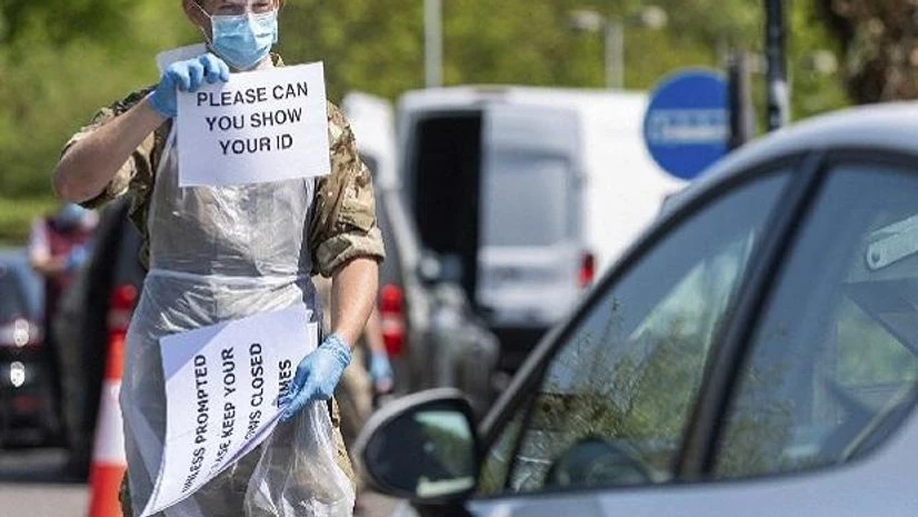 England, britain, UK, coronavirus, covid 19 Torquay: In this undated handout photo issued by the Ministry of Defence on Monday, April 27, 2020, a royal marine is working at a Mobile Testing Unit in Salisbury to conduct COVID 19 testing, for NHS key workers, in Torquay, England. AP/PTI