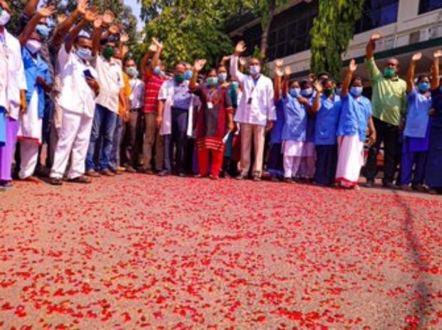 Indian Air Force helicopter showers flower petals over Trivandrum Medical College Hospital Indian Air Force helicopter showers flower petals over Trivandrum Medical College Hospital