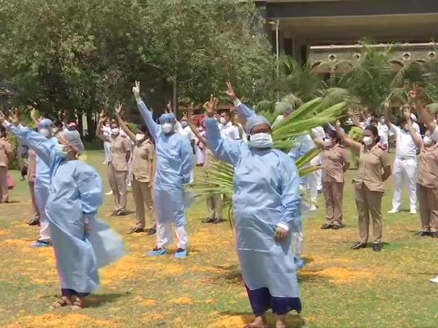 Indian Air Force helicopter showers flowers on the staff of Indian Navy's INHS Asvini in Mumbai Indian Air Force helicopter showers flowers on the staff of Indian Navy's INHS Asvini in Mumbai