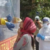 New Delhi: A medics collects samples for swab tests from a COVID-19 mobile testing van, during the nationwide lockdown to curb the spread of coronavirus, at Ramakrishna Mission area in New Delhi, Saturday, May 2, 2020. (PTI Photo/Manvender Vashist)