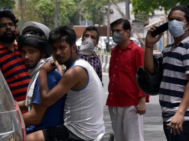 Since early morning, people started thronging the liquor shops, often throwing social distancing norms to the wind Since early morning, people started thronging the liquor shops, often throwing social distancing norms to the wind