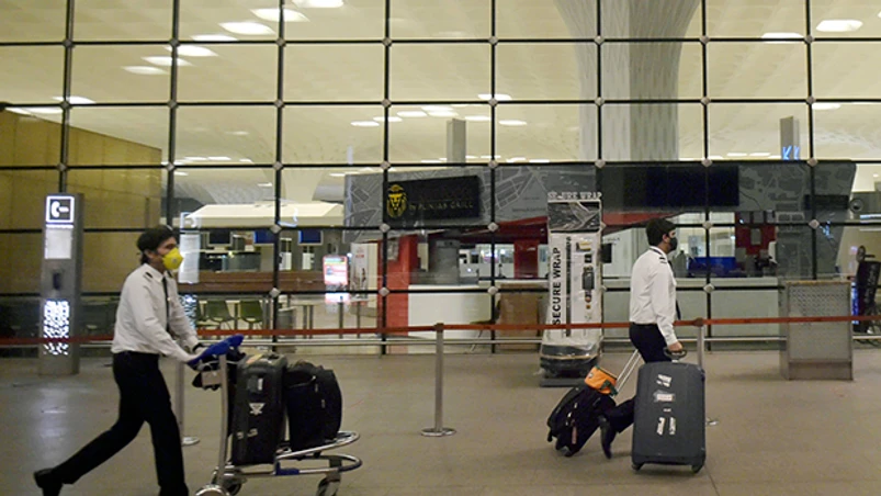 India's mass evacuation, Vande Bharat Mission, special Air India flights, Indians stranded abroad, Coronavirus, Covid-19, Bahrain, UAE, USA, Malaysia, Kuwait, Singapore, London The crew members of the special Air India flight for London arrive at Mumbai Airport Terminal 2. Photo: PTI