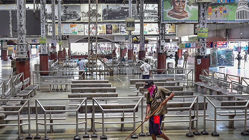 Shramik train, Howrah Station, Kolkata railway station, Indian Railways A worker cleans Howrah station before the arrival of 'Shramik Special' train transporting migrants from various parts of the country, during the ongoing Covid-19 nationwide lockdown, in Kolkata. Photo: PTI