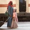 Health workers conduct thermal screening of passengers who have arrived from Delhi by a special train at Howrah station, during the ongoing COVID-19 nationwide lockdown, in Kolkata