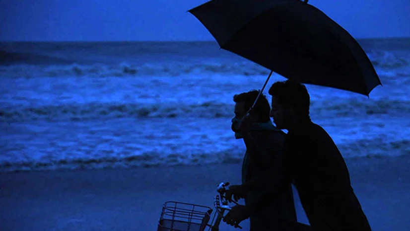 Cyclone Amphan People watch as waves crash along the shore ahead of cyclone 'Amphan' landfall, in Balasore district. Photo: PTI