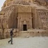 Photograph by John Stanmeyer /National Geographic  Paul Salopek wanders through the ancient Nabataean ruins of Madain Salih, carved into sandstone outcrops some 2,000 years ago. These structures were used as tombs for the wealthy during the Nabataean