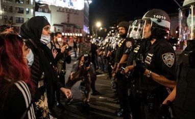 George Floyd, US Violence A protester argues with a NYPD police during a march against the death in Minneapolis police custody of George Floyd, near Manhattan bridge in the Manhattan borough of New York City, U.S.