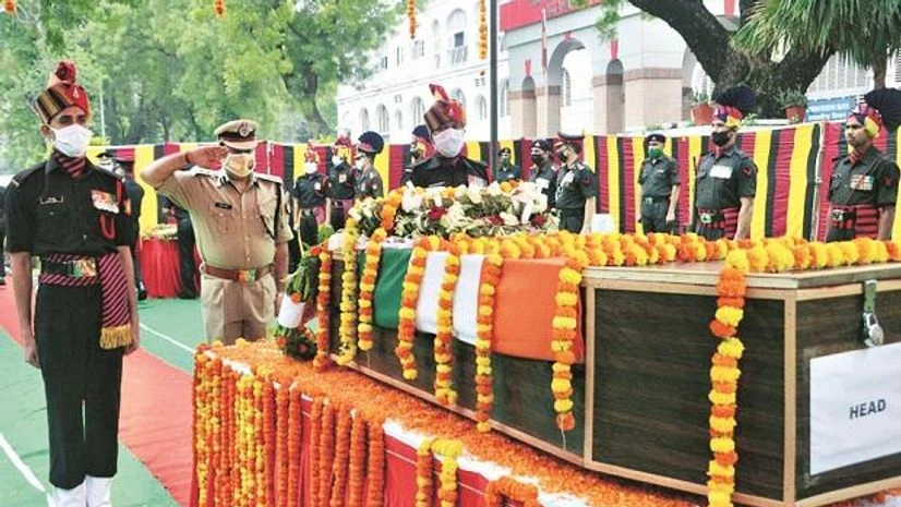 Inspector General of Police Kavindra Pratap Singh pays tribute to Naik Deepak Kumar, who lost his life in clashes with Chinese troops, at a ceremony in Prayagraj on Friday (Photo: PTI) Inspector General of Police Kavindra Pratap Singh pays tribute to Naik Deepak Kumar, who lost his life in clashes with Chinese troops, at a ceremony in Prayagraj on Friday (Photo: PTI)