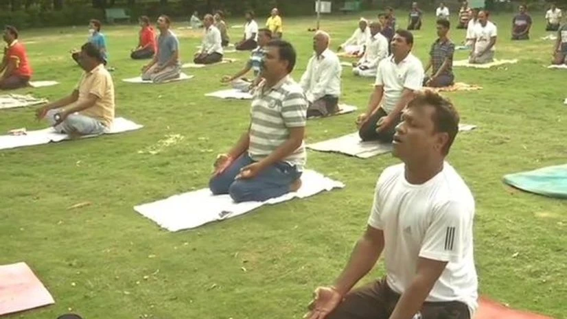 yoga day People perform yoga at a garden in Kalaburagi, Karnataka