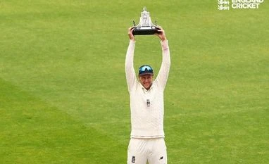 Real privilege to play alongside both Jimmy and Stuart, says Joe Root Joe Root with Wisden Trophy