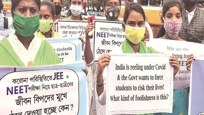 neet, jee TMC Chhatra Parishad activists during a protest in Kolkata against the central government for conducting NEET and JEE exams amid the coronavirus pandemic (Photo: PTI)