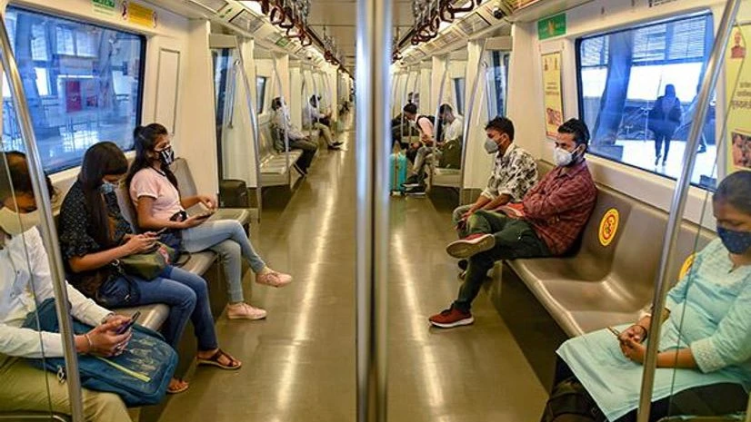 Delhi metro Commuters travel in a metro train after Delhi Metro resumed services with curtailed operation of the Yellow Line and Rapid Metro, amid the ongoing coronavirus pandemic, in New Delhi. Photo: PTI