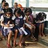 Children going to school by boat in Kerala backwaters. Photo: Shutterstock