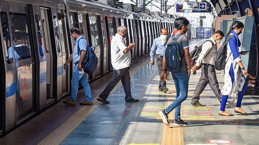 Delhi metro Passengers travel in a metro train after the metro services resume on Blue line with certain restrictions, in New Delhi. Photo: PTI