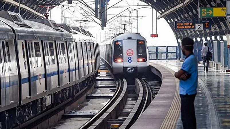 Delhi metro A metro train arrives at a platform. Photo: PTI