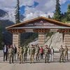 BRO DG Lt Gen Harpal Singh with others poses for photographs during his visit to the newly constructed 'Atal tunnel' for inspection and review work, ahead of its inauguration, in Manali
