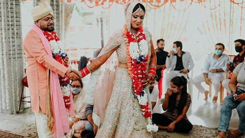 wedding Corona time weddings are marked by fewer guests as well as adherence to norms of social distancing and rule of wearing face masks. Source: Emotiongraphers Films