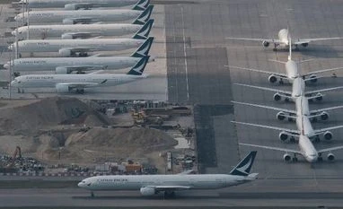 Hong Kong's Cathay Pacific losses narrow as COVID restrictions ease Cathay Pacific aircraft